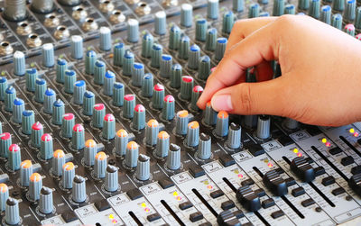 Close-up of hands playing guitar