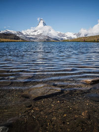 Scenic view of matterhorn with lake
