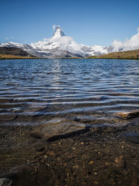 Scenic view of frozen lake against sky