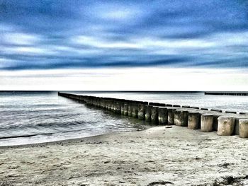 Scenic view of sea against cloudy sky