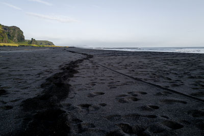 Scenic view of beach against clear sky