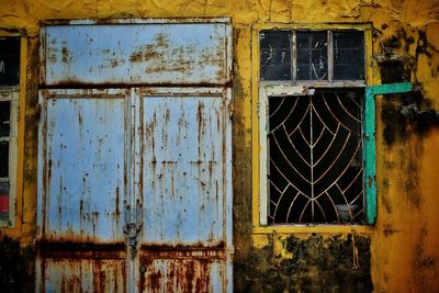 Rusty door and window of abandoned building