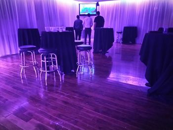 Chairs and tables in illuminated room