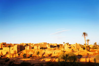 Townscape at erg chebbi desert against sky