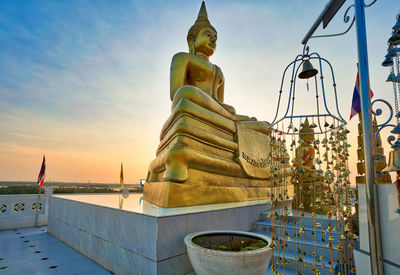 Low angle view of statue against sky