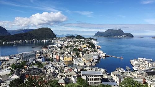 High angle view of bay and buildings against sky