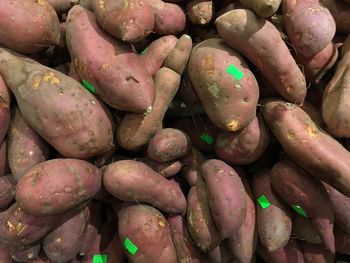 Full frame shot of sweet potatoes for sale at market stall