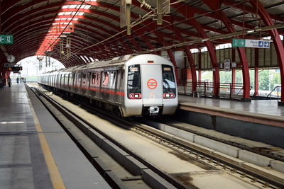 Delhi metro train arriving at jhandewalan metro station in new delhi, india, asia, public metro