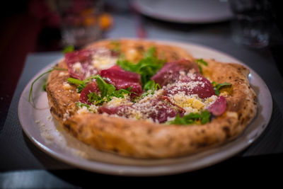 High angle view of pizza in plate on table