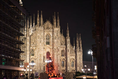 Illuminated buildings in city at night