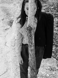 High angle view of woman standing by tree