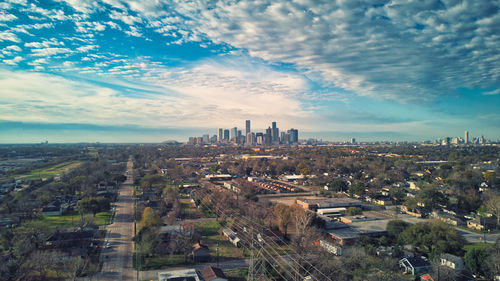 High angle view of buildings in city against sky