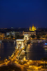 High angle view of illuminated szechenyi chain bridge and hungarian parliament building at night