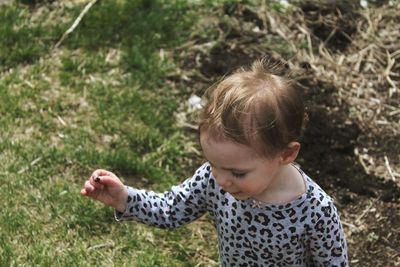 High angle view of cute girl on field