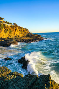 Scenic view of sea against clear blue sky