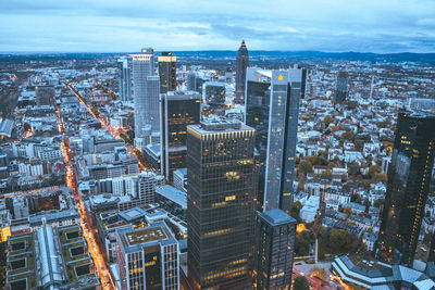 High angle view of modern buildings in city against sky