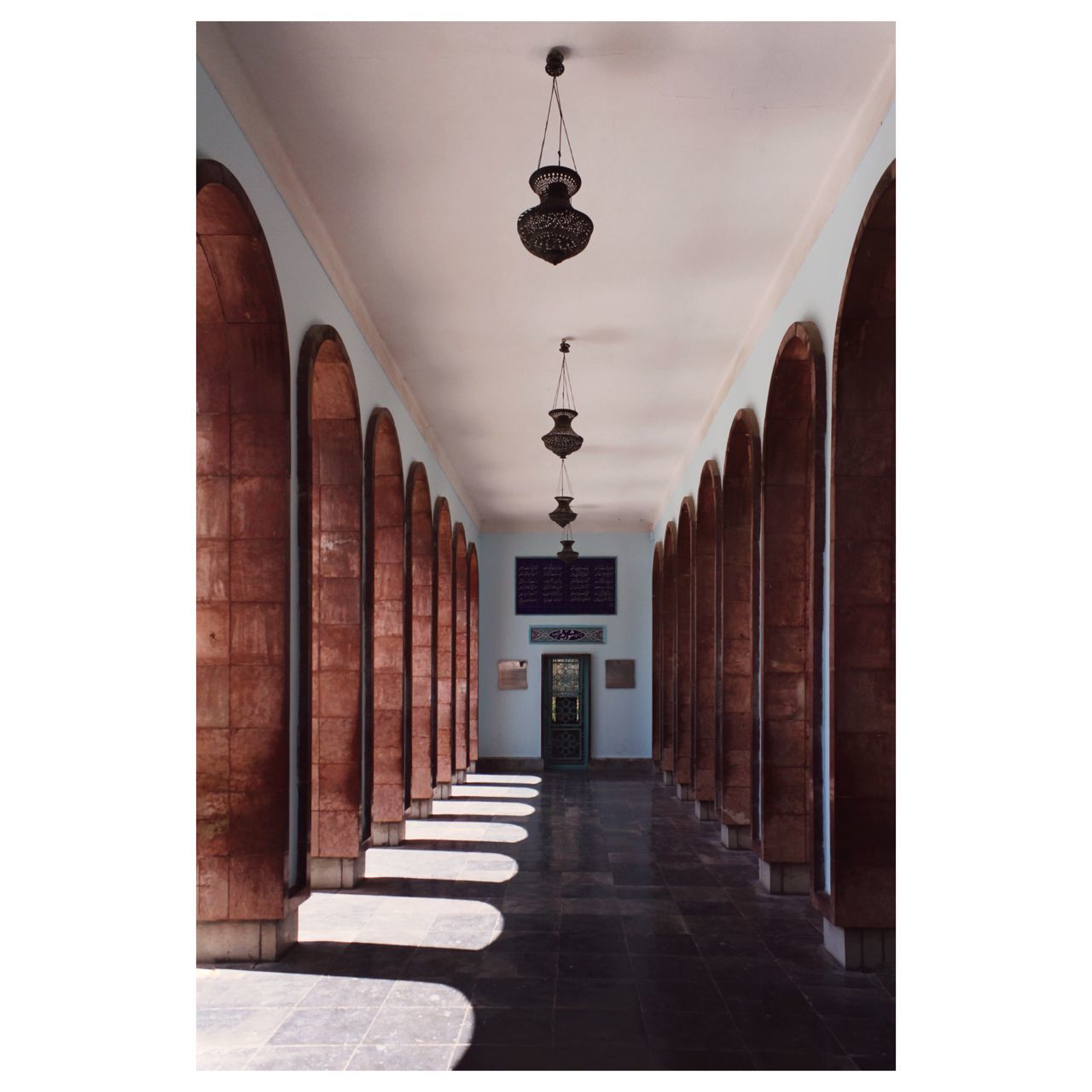 architecture, arcade, corridor, built structure, building, indoors, transfer print, no people, arch, in a row, lighting equipment, the way forward, auto post production filter, hall, interior design, diminishing perspective, day