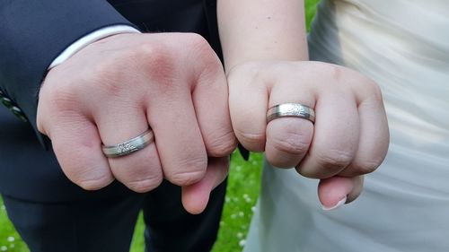 Close-up of couple holding hands