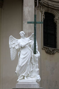 Statue of angel outside historic building