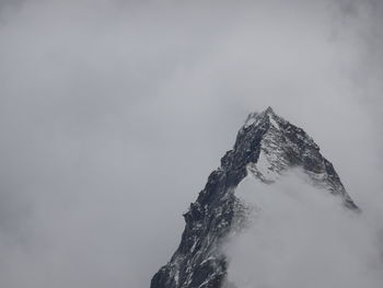 Low angle view of snowcapped mountain against sky ama dablam