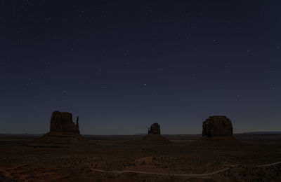 Scenic view of rock formation against sky at night