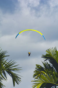 Low angle view of kite flying against sky