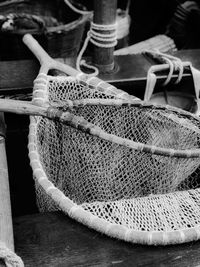 Close-up of fishing net on wooden table