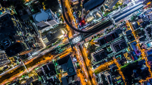 High angle view of city lit up at night