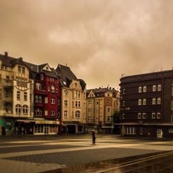 Buildings against sky at sunset