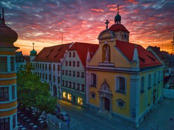Low angle view of building against sky during sunset