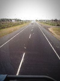 Close-up of road against sky