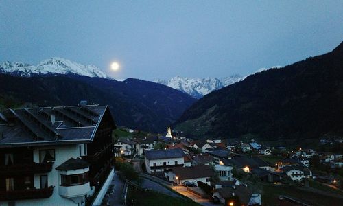 Scenic view of mountain range against cloudy sky