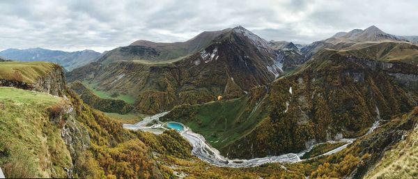 Panoramic view of lake and mountains against sky