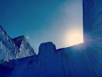 Scenic view of mountains against clear blue sky