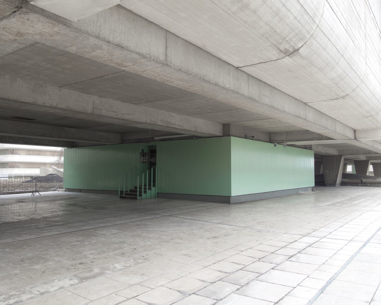 architecture, built structure, architectural column, flooring, indoors, ceiling, tile, subway, illuminated, no people, tiled floor, empty, public transportation, transportation, day, parking lot, direction, building, absence, parking garage, long, underpass