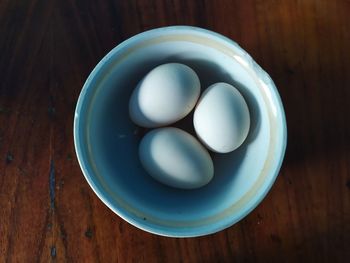 Directly above shot of eggs in bowl on table