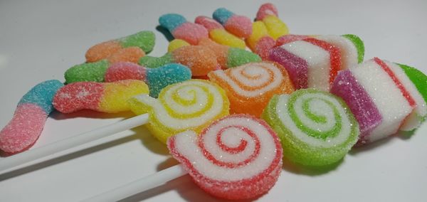 High angle view of multi colored candies on table
