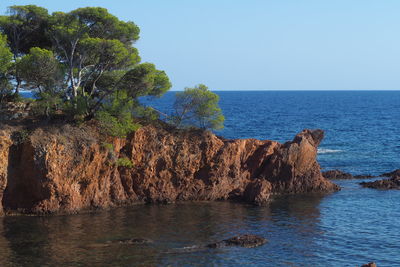 Scenic view of sea against clear blue sky