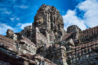 The bayon, prasat bayon is a richly decorated khmer temple at angkor in cambodia