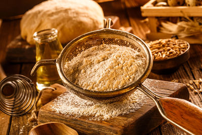 Ingredients for the dough on wooden board.