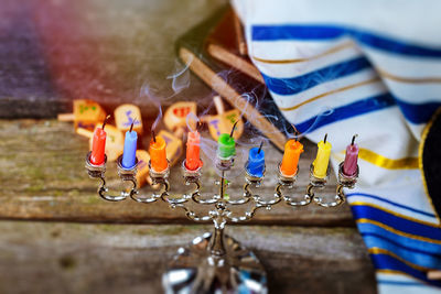 Close-up of colorful candles on table during hanukkah