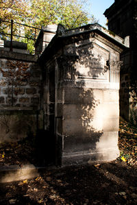 Old abandoned house by building