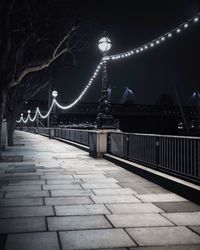 Illuminated bridge at night