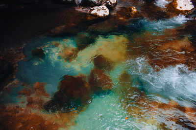 High angle view of rocks in sea