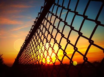 Chainlink fence at sunset