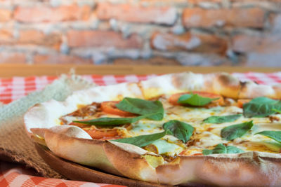 Close-up of pizza served on table