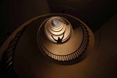 Spiral staircase in a tall multi-floor house, in the form of a golden ratio, architecture, concept