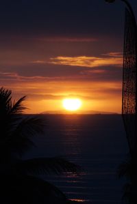 Scenic view of sea against romantic sky at sunset