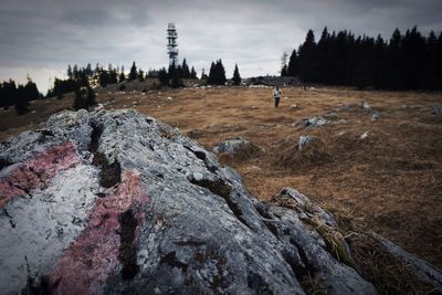 Scenic view of rocks on mountain against sky