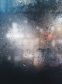 Full frame shot of raindrops on window